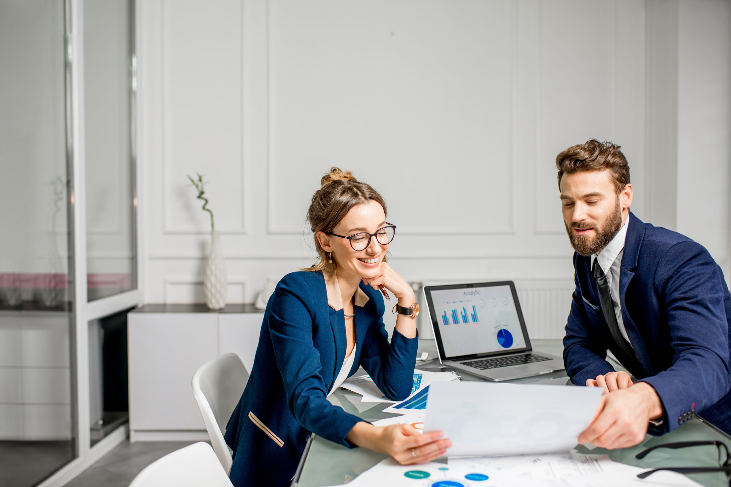 One woman and one man discuss on investments